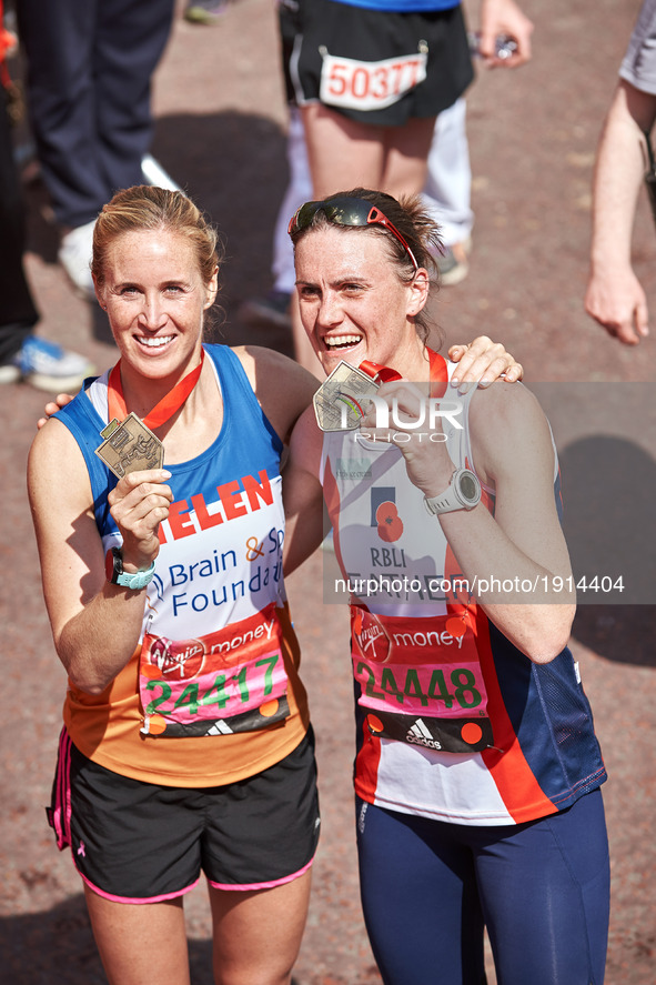 Helen Glover (L) and Heather Stanning pose for a photo after completing the Virgin London Marathon on April 23, 2017 in London, England.  