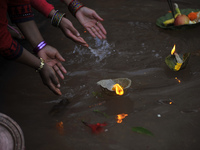 Devotees offering butter lamps during the Mother's Day celebration at Matatritha temple in Kathmandu, Nepal on Wednesday, April 26, 2017. Mo...