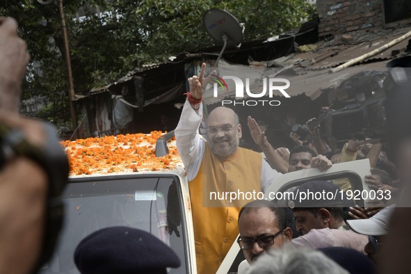 National President of Bharatiya Janata Party (BJP), Amit Shah visits   party worker's home in slum area at Chetla in Bhabanipur in  Chief Mi...