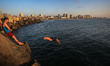 Palestinians enjoy warm weather at the beach of Gaza shore in Gaza City, Gaza on April 28,...