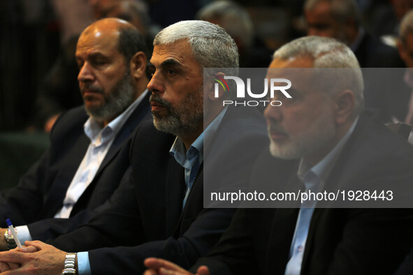 Yahya Sinwar (C-L), the new leader of the Hamas Islamist movement in the Gaza Strip and senior political leader Ismail Haniyeh (C) attend a...