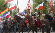 People wearing Polish Army Military Uniforms from diferent centuries take part of the patr...