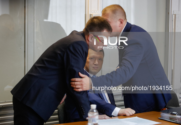 Viktor Yanukovych (not present) defenders put heads together during the court hearing. Obolon district court of Kyiv starts the preliminary...
