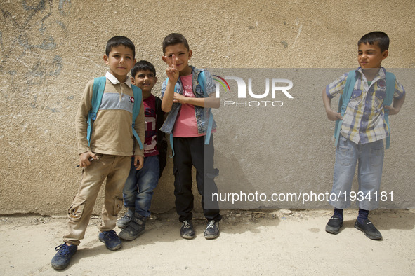 East Mosul is slowly rising from the ashes. Students after school. Mosul, Iraq, 2 May 2017 