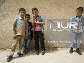 East Mosul is slowly rising from the ashes. Students after school. Mosul, Iraq, 2 May 2017 (