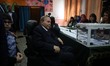 Algerian President Abdelaziz Bouteflika is seen on a wheelchair as he casts his vote at a...