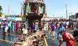 Tamil Hindu devotees perform the Angapradakshinam ritual (as an act of penance) during the...