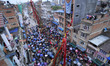 Nepalese Female devotees pulling the chariot of the Rato Machindranath deity from Lagankhe...
