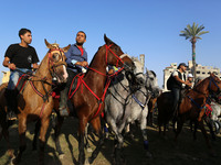 Demonstrators take part in a march  for horse rider in support of hunger striker Palestinian prisoners in Israeli jails, from Es-sheikh Acli...