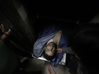 The dead body of a Palestinian fisherman, Mohammed Baker (28), after Israeli forces delivered the body to Palestinian authorities in Gaza Ci...