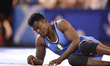 Erica Wiebe for Canada competes against Blessing Onyebuchi for Nigeria at Wrestling as par...