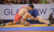 Mike Grundy for England competes against Gerlad Meyer for South Africa at Wrestling as par...