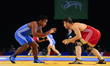 Gilbert Emilie for Mauritius competes against Kushan Sandrage for Sri Lanka at Wrestling a...