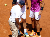 Tennis ATP Internazionali d'Italia BNL Second Round
Nicolas Almagro (SPA) injured receiving assistance by Rafa Nadal (SPA) and the referee...