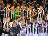 Juventus players raise the Italian Cup after the final between Juventus FC and SS Lazio at Olympic Stadium on may 17, 2017 in Rome, Italy. J...