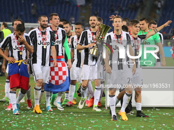 Juventus players celebrate the Coppa Italia victory after the final between Juventus FC and SS Lazio at the Olympic Stadium on May 17, 2017...