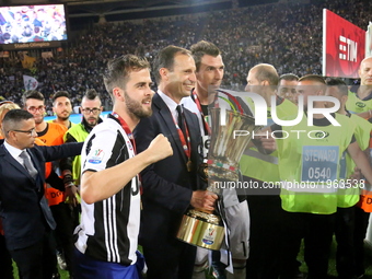 Massimiliano Allegri, head coach of Juventus FC,  celebrates with Miralem Pjanic  and Mario Mandzukic the Coppa Italia victory after the fin...