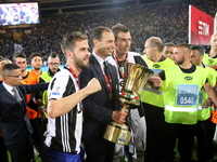 Massimiliano Allegri, head coach of Juventus FC,  celebrates with Miralem Pjanic  and Mario Mandzukic the Coppa Italia victory after the fin...