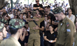 Family and relatives mourn during the funeral of Daniel Kedmi, an infantry soldier, traini...