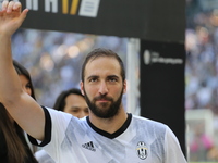 Gonzalo Higuain is awarded as Juventus's best player in the 2016/2017 season before the Serie A football match between Juventus FC and FC Cr...