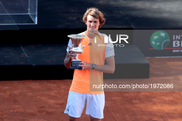 Alexander Zverev of Germany poses with the trophy after winning the ATP Singles Final match between Alexander Zverev of Germany and Novak Dj...