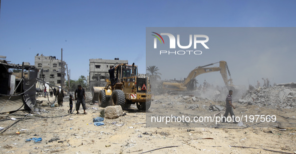 Palestinian rescue workers search for victims, in a building destroyed by an Israeli air strike in Rafah in Rafah in the southern Gaza Strip...