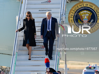 US President Donald Trump and First Lady Melania Trump step off Air Force One upon arrival at Rome's Fiumicino Airport on May 23, 2017. Dona...