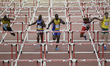 Athletes compete in the 110m hurdles at the 20th Commonwealth games in Hamden Park in Glas...