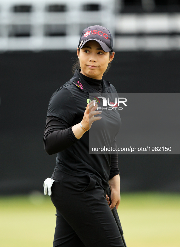 Moriya Jutanugarn of Thailand acknowledge the crowd after finishing the first round of the LPGA Volvik Championship at Travis Pointe Country...