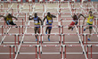 Athletes compete in the 110m hurdles at the 20th Commonwealth games in Hamden Park in Glas...