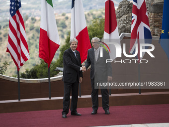  European Commission President Jean-Claude Junker  shakes hands with italian prime minister paolo gentiloni as he arrives at the Ancient The...