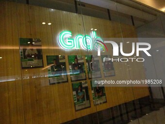 The logo of transport network company Grab is seen inside a mall in Manila, Philippines on Saturday, May 27, 2017. As its accreditation with...