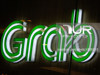 The logo of transport network company Grab is seen inside a mall in Manila, Philippines on Saturday, May 27, 2017. As its accreditation with...