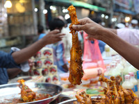 People gather to buy foods for breaking their fast during the Muslims holy fasting month of Ramadan at the traditional food market popular f...