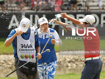 Shanshan Feng of China is showered with water by Haru Nomura of Japan after winning the Volvik Championship during the final round of the Vo...