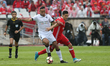 Benfica's Mexican forward Raul Jimenez  fights for the ball with Vitoria Guimaraes' Brazil...
