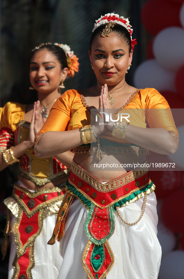 Sri Lankan girls from the Pratibha Dance and Music Academy perform a traditional dance during the festival of Vesak in Mississauga, Ontario,...
