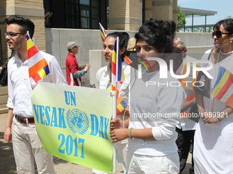 Sri Lankan youth take part in a procession during the festival of Vesak in Mississauga, Ontario, Canada, on 28 May 2017. Vesak (Wesak) commo...