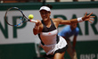 Spain's Garbine Muguruza returns the ball to Estonia's Anett Kontaveit during their tennis...