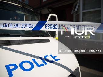 A police van guards the cordoned off area of a street, where part of the investigation in to the Manchester Arena explosion is taking place,...