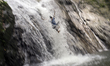 A girl slides down from waterfall near Hulu Selangor, 25 kilometers outside Kuala Lumpur,...