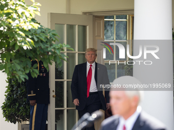 VP Mike Pence introduces President Donald Trump as he walks out the Oval Office to make his statement that the United States is withdrawing...