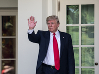 President Donald Trump heads back to the Oval Office, after speaking and making the announcement that the United States is withdrawing from...