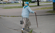 An elderly woman with a walking stick is seen in a residential area of Brest, Belarus on 1...