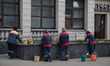 Cleaners are seen at the central station of Brest on 1 June, 2017. 