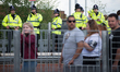 Police officers patrol as people arrive for the One Love Manchester benefit concert at the...