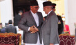 Newly elected Prime Minister of Nepal, Sher Bahadur Deuba shake hand with Formal Prime Min...