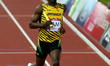 (140802) -- GLASGOW, Aug. 2, 2014 () -- Usian Bolt of Jamaica crosses the finish line duri...