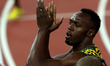(140802) -- GLASGOW, Aug. 2, 2014 () -- Usian Bolt of Jamaica greets the spectators after...