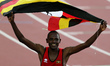 (140802) -- GLASGOW, Aug. 2, 2014 () -- Moses Kipsiro of Uganda celebrates with the nation...